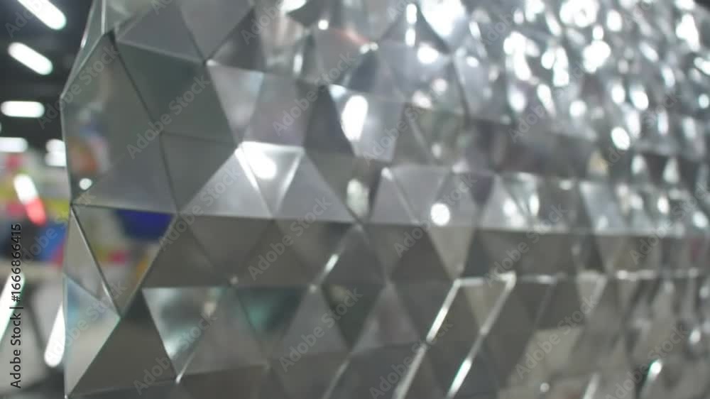 Aufkleber silver geometric pattern wall with triangle facets reflecting ambient light interior architecture an