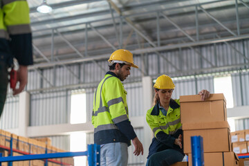 Warehouse worker working in warehouse storage. Foreman or worker work at factory site check up products in site. Inventory worker working in  factory Storehouse