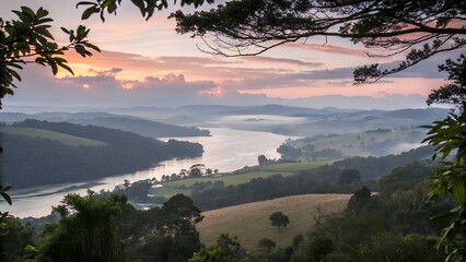 Scenic view of a river valley at sunrise framed by foliage and trees