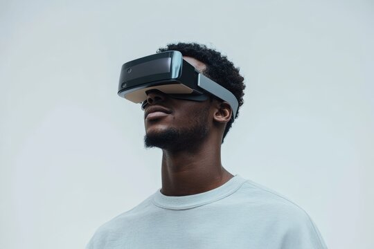 A young man wearing a VR headset, experiencing immersive virtual reality.