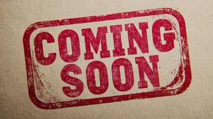 Red and white distressed stamp with the words coming soon