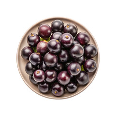 Overhead view of ripe jabuticaba fruits piled on an earthenware dish