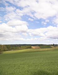 Green fields and hills in Wiezyca, Kashubian Region, Poland.