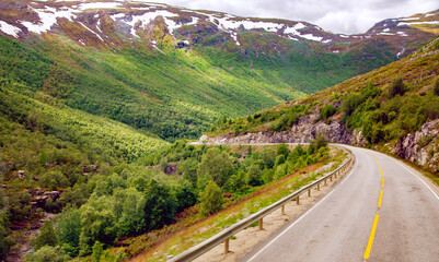 High-quality roads with fog markings among the high Scandinavian mountains and the plains of Norway. The weather in this region can change every hour.