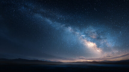 Naklejka premium The Milky Way galaxy sweeping across the dark sky, casting its cosmic glow over the peaceful horizon, creating an awe-inspiring scene.