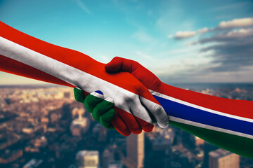 Shaking hands Austria and The Gambia