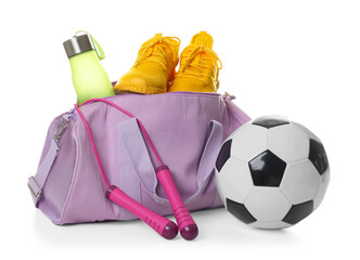 Stylish gym bag with sports equipment, bottle and sneakers isolated on white