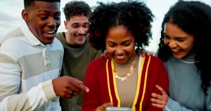Laughing, phone and text message with friends outdoor together for celebration or success. App, mobile search and social media with group of funny student people in nature for college acceptance