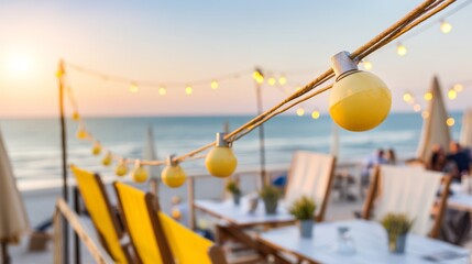 Beachside seating area with string lights and ocean view at sunset