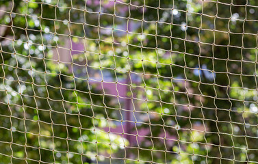 Background of panel flats behind a net. Blurry abstract background. 