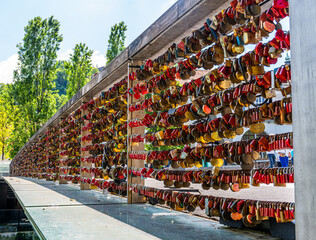 bridge railing covered with locks in Ljubljana, Slovenia