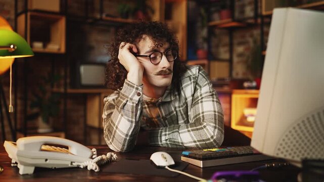 Tired male manager falling asleep while working in 90s retro style office