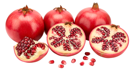 A group of pomegranates including whole fruits and cut halves displaying the seeds on a black backdrop isolated on transparent white background]