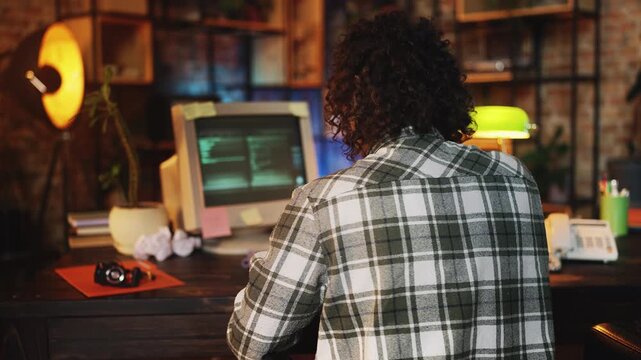 Programmer upset after receiving system error message on computer, retro office