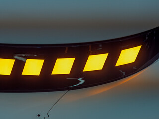 Modern Car Headlight Design with Bright Orange Accents