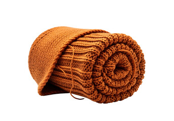 A rolled, warm-toned knitted fabric, featuring intricate patterns and visible stitches, sits against a dark background.