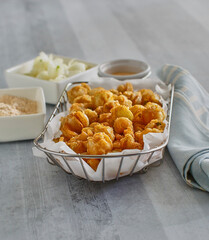 bite sized blooming pearl onions, crispy fried and served with a spicy dipping sauce