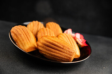 Madeleine cookies sweet dessert traditional french sweets tasty snack fresh delicious gourmet food background on the table rustic top view copy space