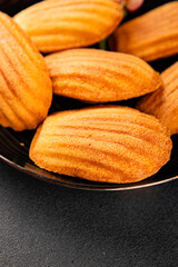 Madeleine cookies sweet dessert traditional french sweets tasty snack fresh delicious gourmet food background on the table rustic top view copy space