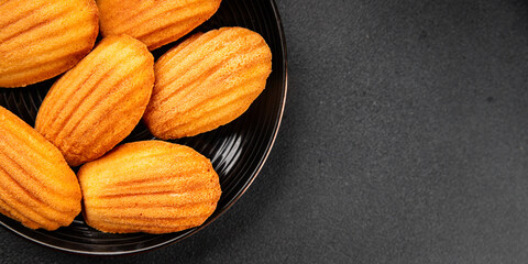 Madeleine cookies sweet dessert traditional french sweets tasty snack fresh delicious gourmet food background on the table rustic top view copy space