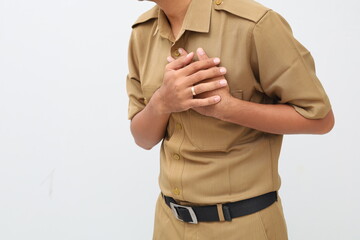 Close up civil servant man holding his left chest. chest pain concept