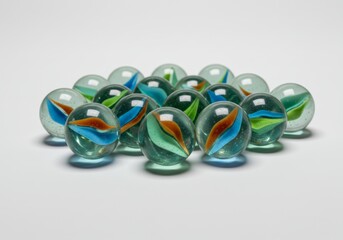 Group of vibrant marble spheres with colorful swirls on a white backdrop