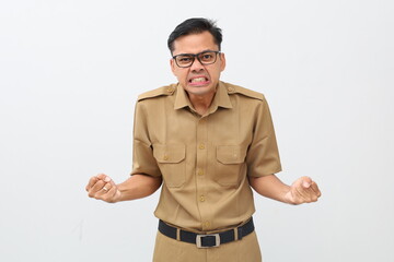 Annoyed young indonesian civil servant man standing with angry expression and gesture