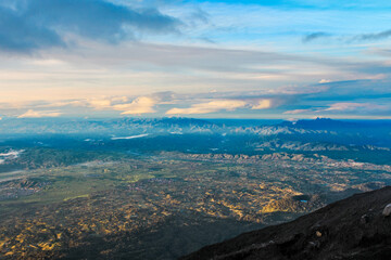 Scenic Mountain View from Summit with Rolling Hills and Clouds