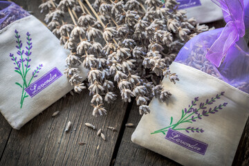 Dried lavender, bunch of dried lavender flowers on the table and lavender bag