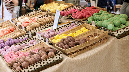 Macarons, French almond pastries, at a market stall in Saint Tropez on the Cote d'Azur, France,...
