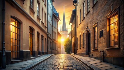 Fototapeta premium Golden Hour Illumination on a Cobblestone Street with Historic Buildings