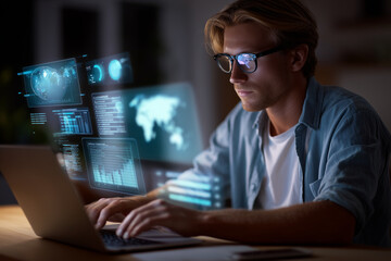 Man using laptop with layered holographic dashboards and maps floating in air.
