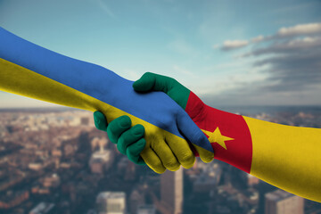 Shaking hands Ukraine and Cameroon