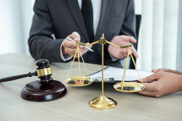 Male lawyer or counselor discussing negotiation legal case with client meeting with document...
