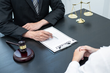Male lawyer or counselor discussing negotiation legal case with client meeting with document...