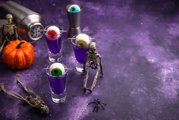 Halloween purple cocktail with eyes.