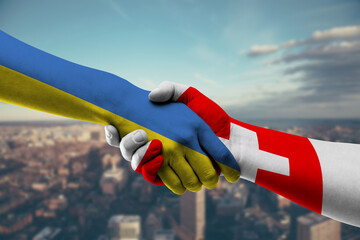 Shaking hands Ukraine and Switzerland