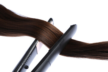 Straightener with brown hair lock isolated on white