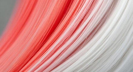 Closeup of a red and white wig, showcasing the texture and color gradient of the hair