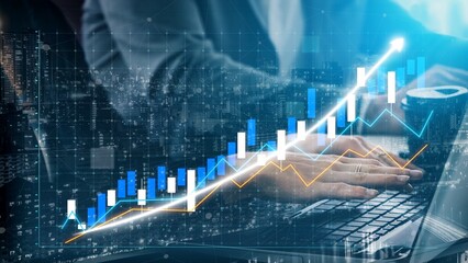 Businessperson engages in financial analysis using graphs and data on a laptop in a modern office. The image illustrates growth and success in the finance sector. Copula