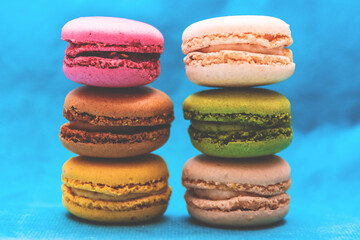Vibrant macarons stacked high, perfect for dessert menus, cafes, and elegant food photography