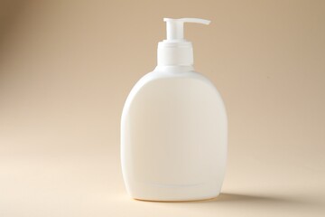 Promotion. Bottle of cosmetic product on beige background