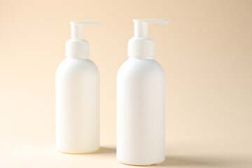 Promotion. Cosmetic products on beige background, closeup