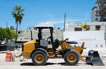 Compact wheel loader. Heavy equipment of compact wheel loader with hydraulic system. Wheel loader heavy machinery. Industrial heavy equipment. Compact wheel loader machinery