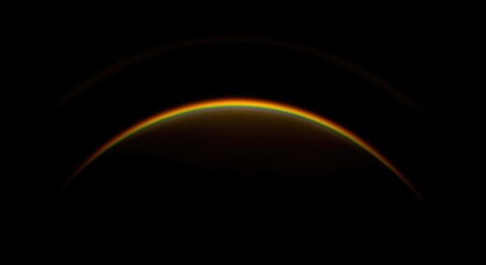 Obraz premium A detailed view of a planet's atmosphere, showing a vibrant orange and yellow horizon against the blackness of space.