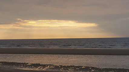 Obraz premium Summer vacation in Ostend, Belgien. Sea, sunset sky, sand on the beach.