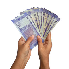 Two hands holding spread of 100 rupee notes banking and financial transactions. Indian currency, bank notes, cash in hand.