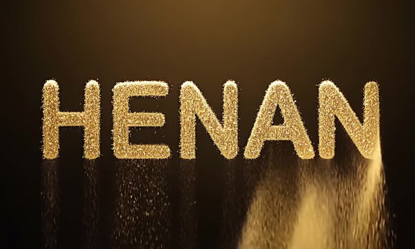 Golden powder gracefully forms letters in a mesmerizing sequence, showcasing the dynamic flow of particles as they create the word HENAN against a dark backdrop