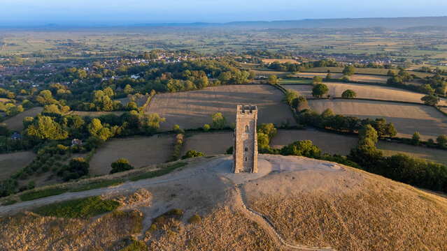 Aerial photograph of the pathway climbing Glastonbury Tor, leading up to St Michael&rsquo;s Tower. Captured just after sunrise, this image highlights the mystique and beauty of Somerset&rsquo;s most famous landma