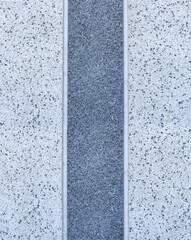 Pebble wall surface with rough texture and natural appearance